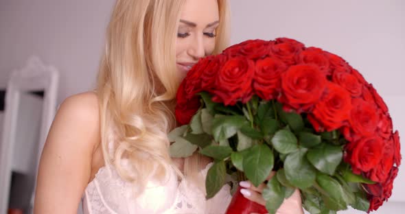 Sexy Woman In White Bra Holding A Rose Bouquet 3