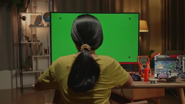 Engineer Asian Girl Is Working With Desktop Computer In Home, Mock Up Green Screen Display