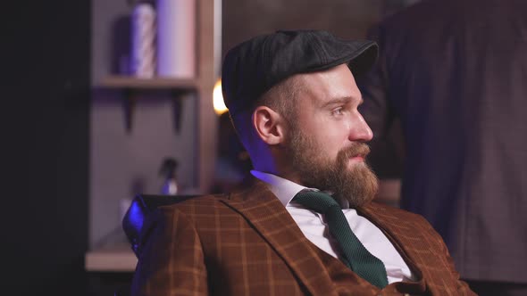 Modern Barber Male Begins To Cut Hair of Client