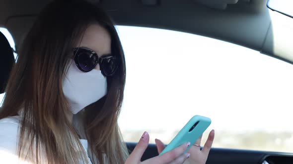 Girl Wearing a Mask During the COVID19 Coronavirus Epidemic a Brunette