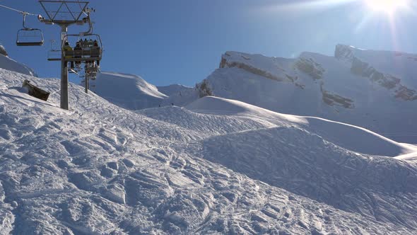 ski area in the Swiss alps with people and chairlifts in the winter ski area of ​​Beckenried