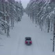 Car Driving on Snowy Road in Winter Forest Aerial View - VideoHive Item for Sale