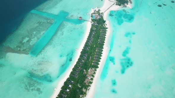 Aerial Drone View of a Beautiful Atoll or Island with a Resort in the Maldives