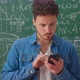 A Bearded Caucasian Man Stands Near the School Blackboard - VideoHive Item for Sale