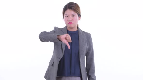 Angry Young Asian Businesswoman Giving Thumbs Down