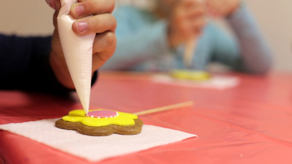 Woman Decorates Cookies