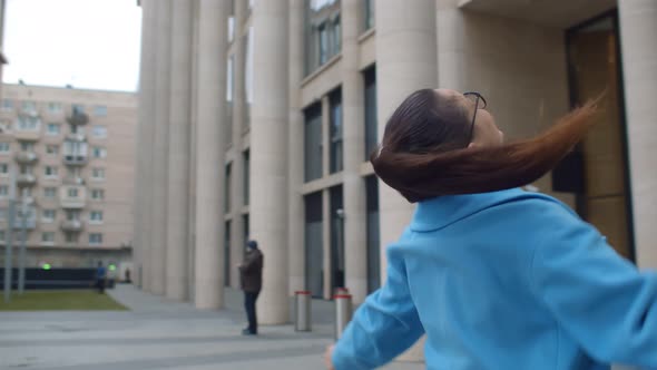 Happy Businesswoman Doing Winner Gesture Celebrating Success Standing Outdoors on Street