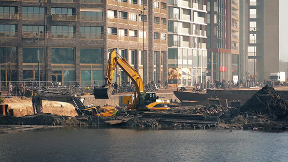 Excavators Working By Harbour In City