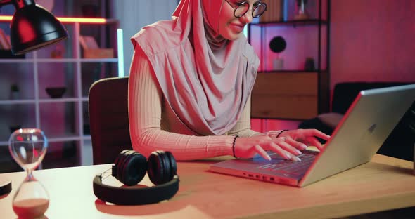 Muslim Girl in Headscarf in Glasses Working on Computer at the Workplace in Home Office