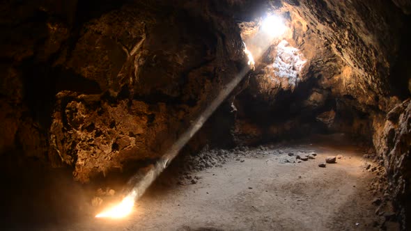 Light Rays Shine Inside Of Lava Tube Cave 1