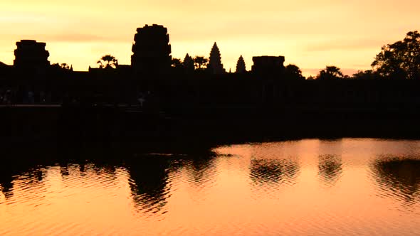 Silhouette Of The Main Temple Buildings With Lake Reflection At Sunrise alt