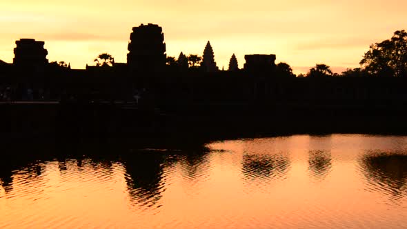 Silhouette Of The Main Temple Buildings With Lake Reflection At Sunrise