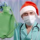 A Doctor in a Santa Hat Holds a Large Enema in His Hands - VideoHive Item for Sale