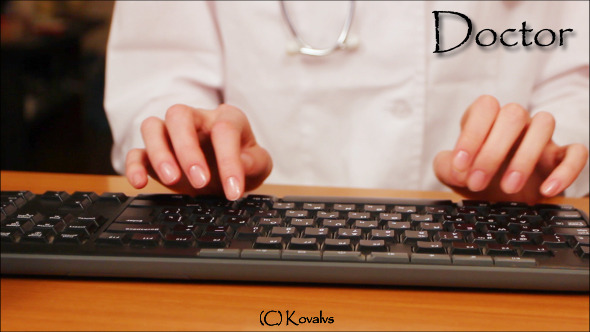 Doctor Working On Computer