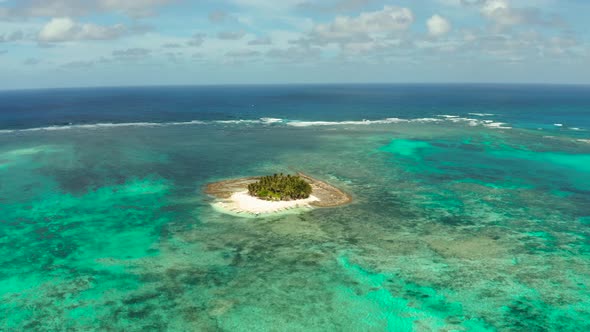 Tropical Guyam Island with a Sandy Beach and Tourists.