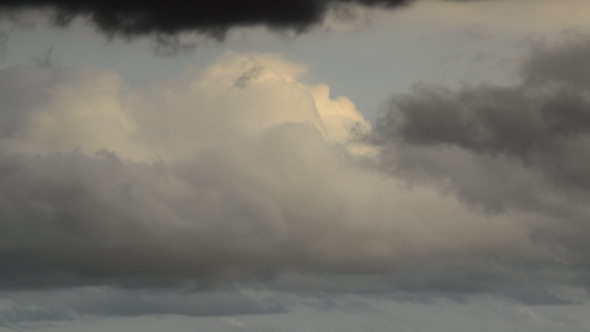 White And Dark Clouds Colide