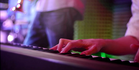 Pianist Playing Keys On A Stage Live