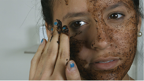Girl Applying Cosmetic Face Mask alt