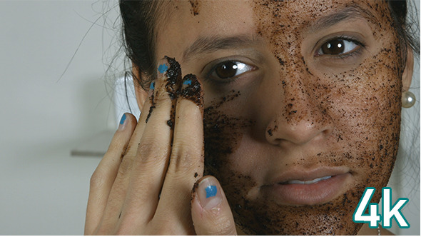 Girl Applying Cosmetic Face Mask