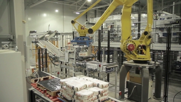 Articulated Robotic Arm At Packaging Line In