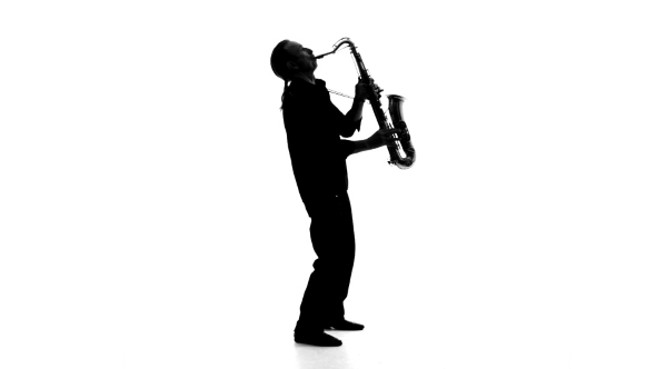 Silhouette Of a Musician Who Plays The Saxophone