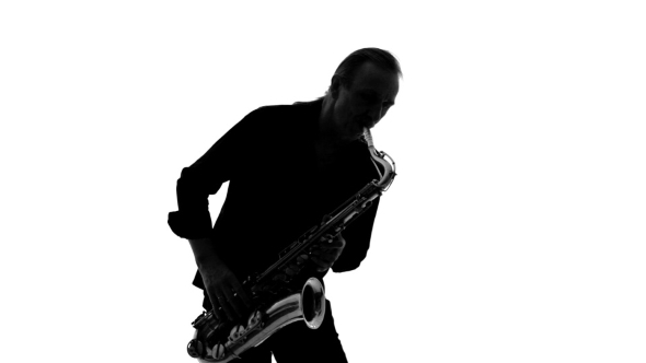 Silhouette Of Musician Playing The Saxophone
