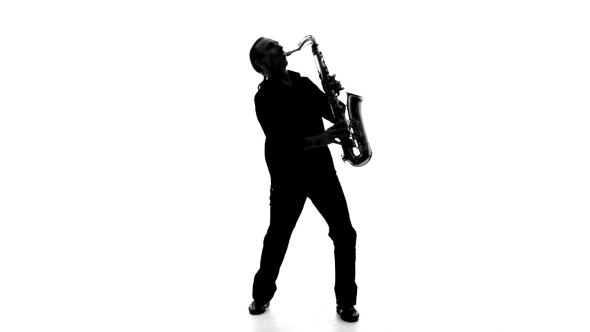 Silhouette Of a Man Playing The Saxophone