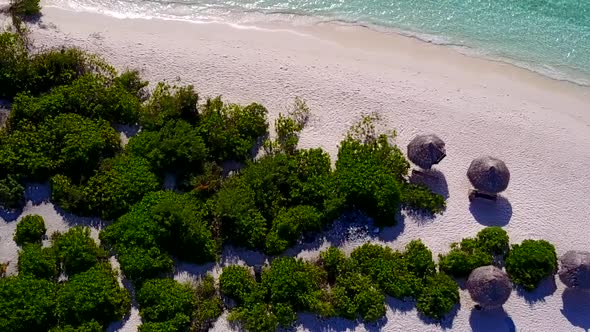 Drone view texture of shore beach by clear ocean and sand background