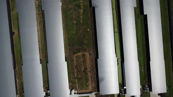 Aerial view of large industrial building or a warehouse. Industrial zone from above, drone flying