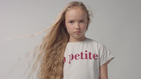 Young Girl in Studio with Long Vawy Hair Portrait