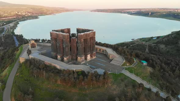 Aerial View Down To Monument Of Chronicles Of Georgia In Sakartvelo With Tbilisi Sea Lake.Georgia