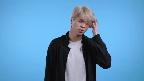 Asian Man Having Headache Studio Portrait