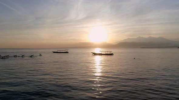 Sunrise Yoga Class on Stand Up Paddle Boards in the Calm Ocean