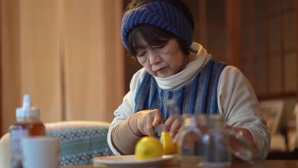 Woman making honey pickled lemon