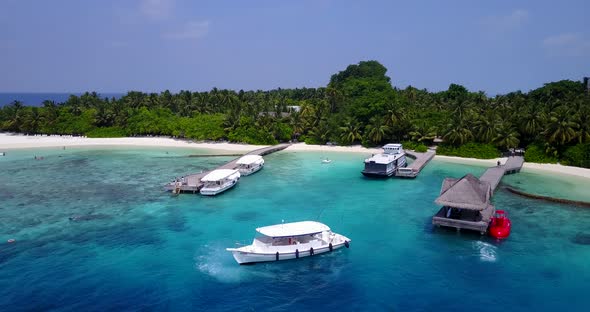 Beautiful aerial copy space shot of a summer white paradise sand beach and blue ocean background in 