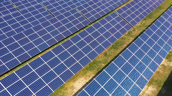 Top view of a new solar farm. Rows of modern photovoltaic solar panels. Renewable ecological source