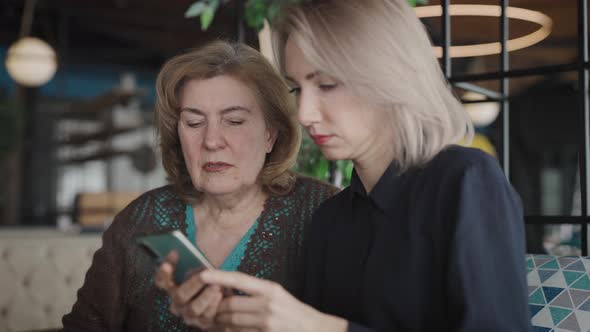 Mom and Daughter in a Cafe