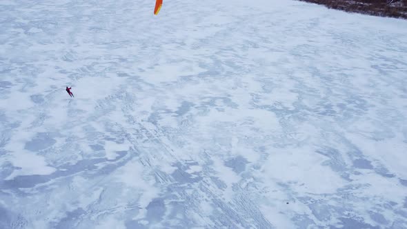 SnowKiting Kitesurfing Sport on the Ice Lake Winter