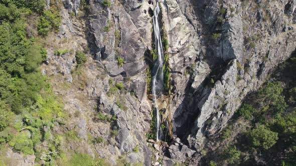 Frecha da Mizarela waterfall, Arouca in Portugal. Aerial top-down circling