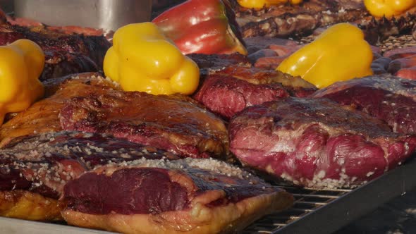 close up barbecue grill with a large assortment of roasted meat