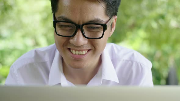 Man Exciting in Front of Laptop