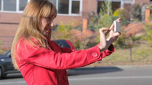 Woman Making Shot on Smartphone