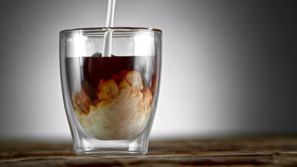 Super Slow Motion Shot of Pouring Cream Into Coffee Drink at 1000Fps