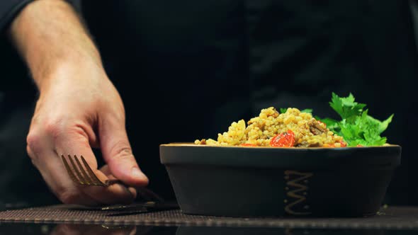 Chef Put Fork And Knife Near The Dish