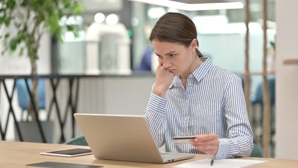 Online Payment Failure on Laptop By Young Woman in Office 