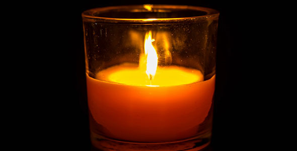 Candle In A Glass Burning