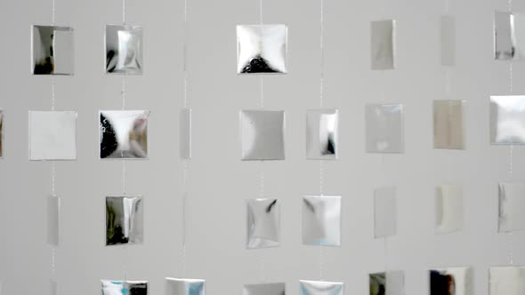 Cool Metal Shapes Hanging On Wall And Moving,With Reflection From Sunlight 1
