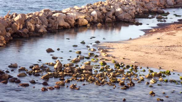 Soft Waves Lapping Against Rocks 2