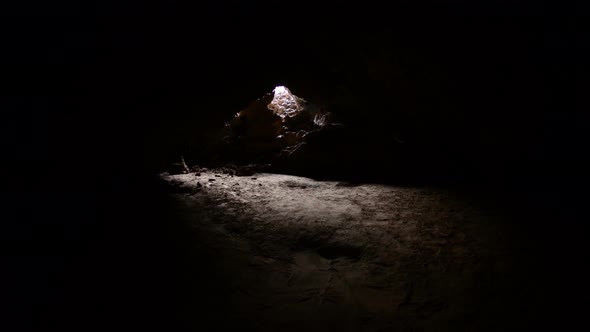 Light Rays Shine Inside Of Lava Tube Cave