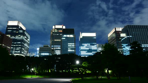 Clouds Passing Downtown Tokyo Skyline At Night From The Royal Garden